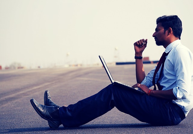 indian man with laptop